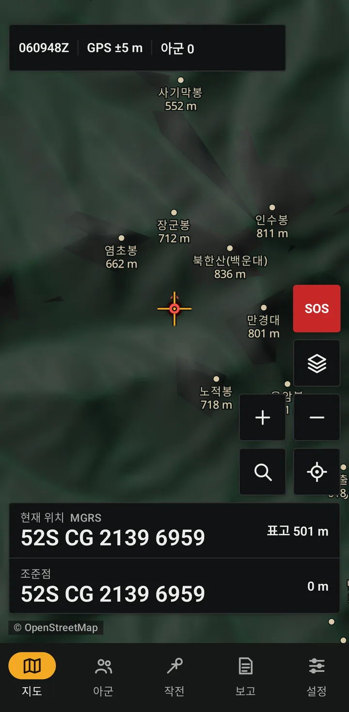 Real Honey Badger App screen (portrait, low-light mode): map around Bukhansan with peak elevations, the reticle, current position MGRS 52S CG 2139 6959, bottom tabs